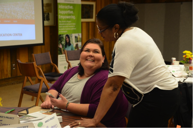 An extension educator from Michigan and an educator from the Georgia-based United Farmers USA (npo) share programming ideas during the professional development conference.